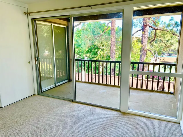 a view of a porch with wooden floor and outdoor space