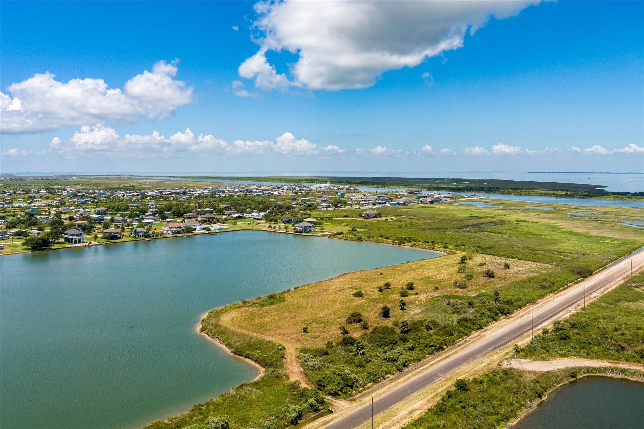 1105 Bob Road Crystal Beach, TX 77650 - Photo 22 of 23 a view of a lake with a city