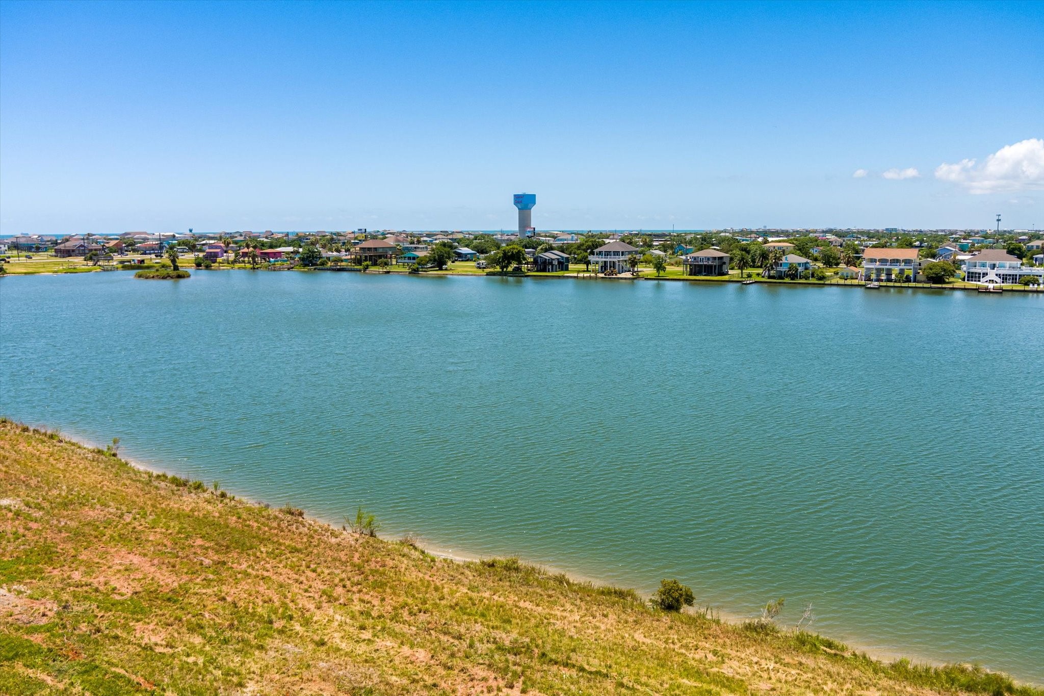 1105 Bob Road Crystal Beach, TX 77650 - Photo 4 of 23 a view of a lake with houses in the back