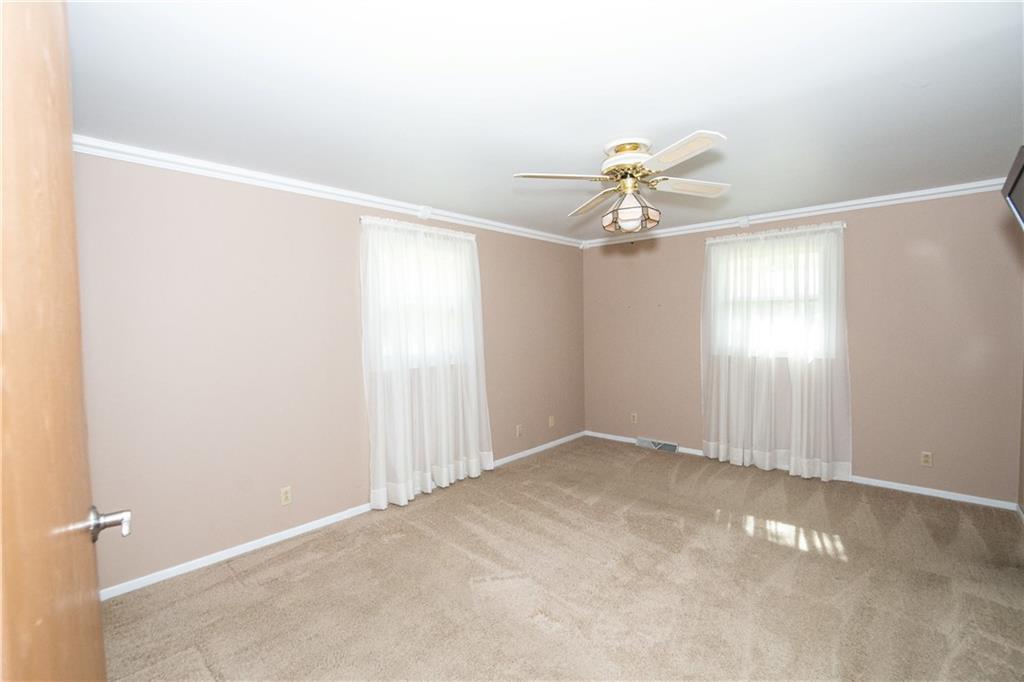 481 South Eberhart Road Butler, PA 16001 - Photo 13 of 25 an empty room with windows and fan