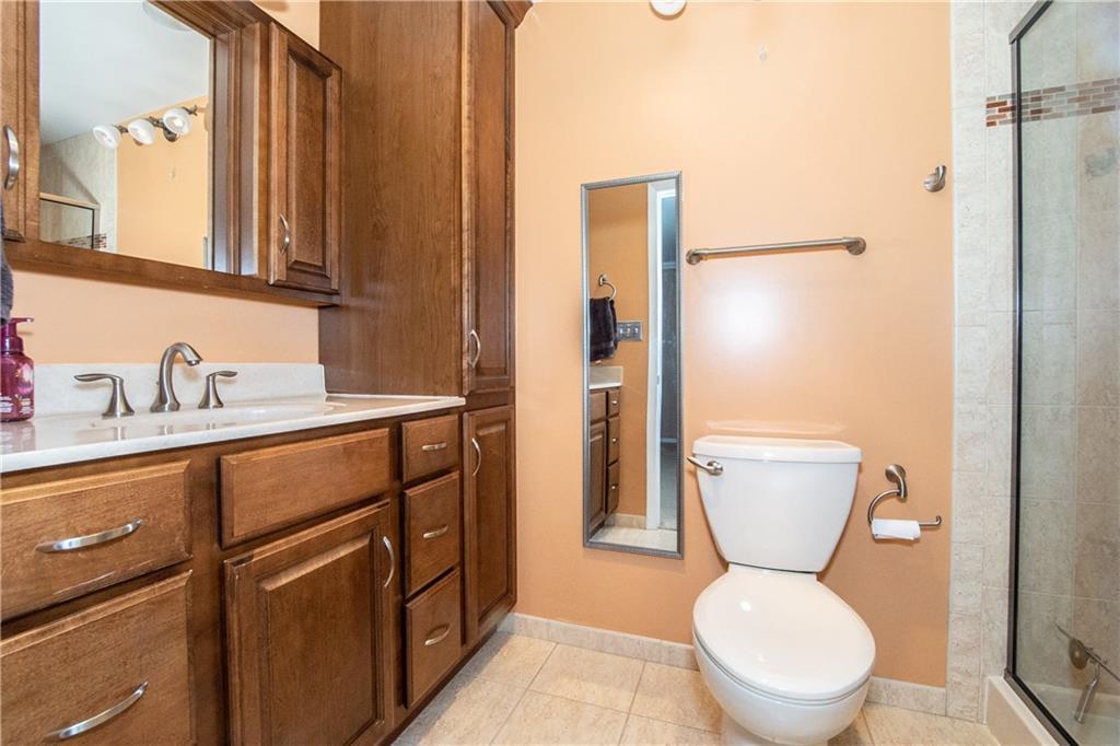 481 South Eberhart Road Butler, PA 16001 - Photo 15 of 25 a bathroom with a toilet sink shower and mirror