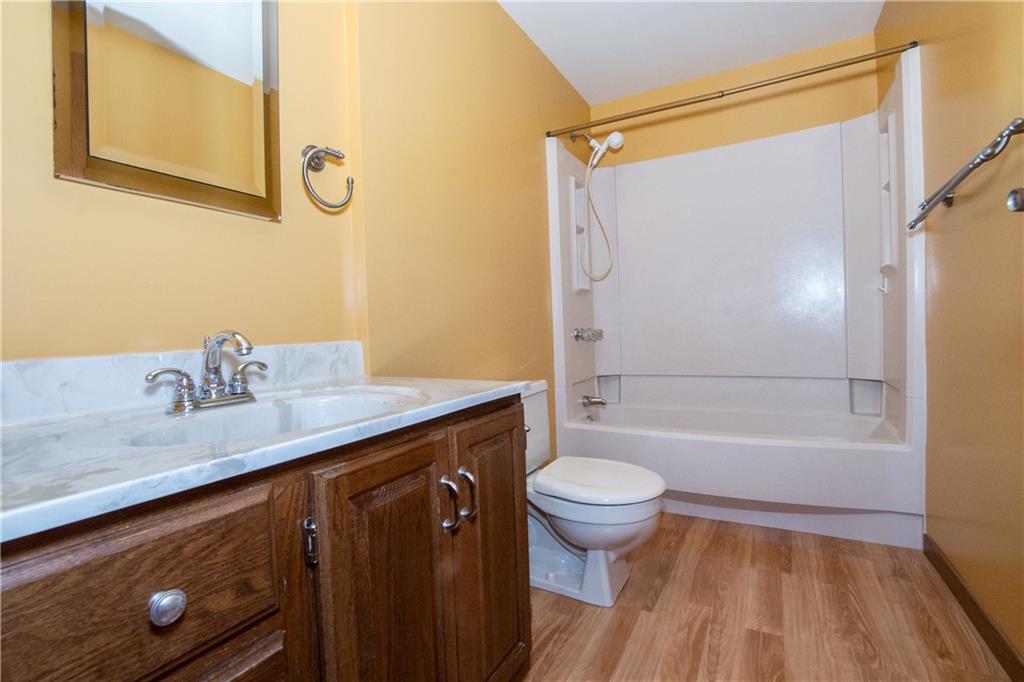 481 South Eberhart Road Butler, PA 16001 - Photo 17 of 25 a bathroom with a granite countertop sink toilet and shower