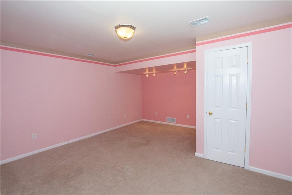 481 South Eberhart Road Butler, PA 16001 - Photo 19 of 25 an empty room with windows and painted walls
