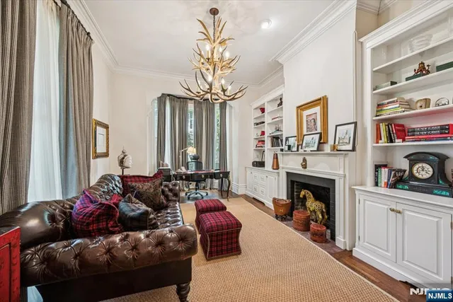 a living room with furniture and a fireplace