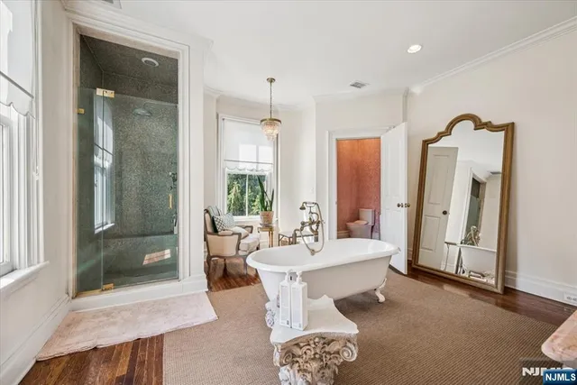 a living room with furniture and a glass door