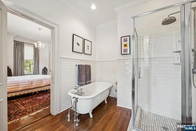 a bathroom with a sink a mirror and a shower