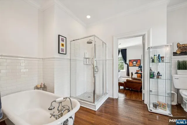 a spacious bathroom with a tub and shower