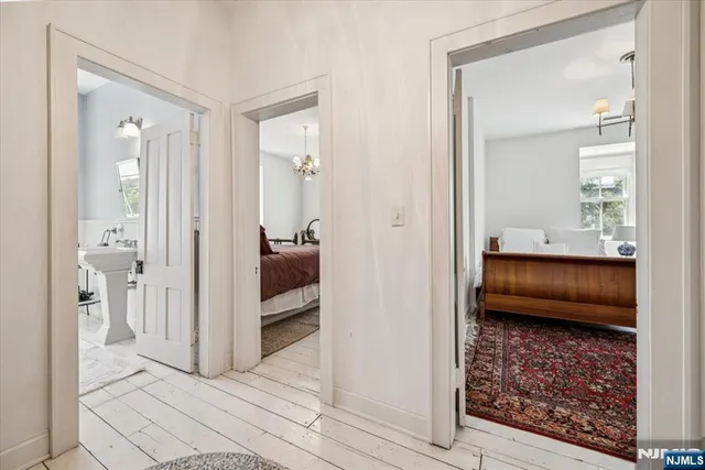 a en suite bathroom with a shower and a sink