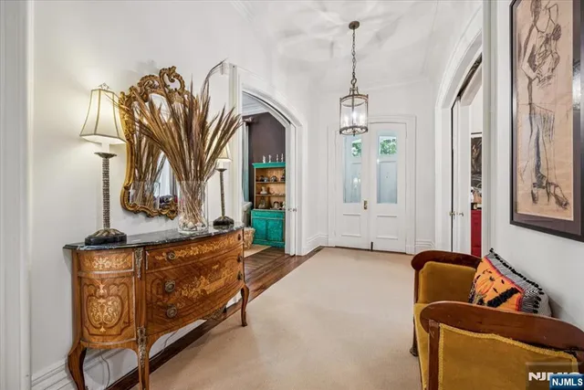 a living room with furniture flowerpot and a window
