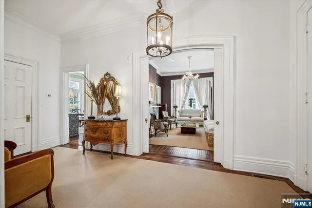 a view of living room with furniture and wooden floor