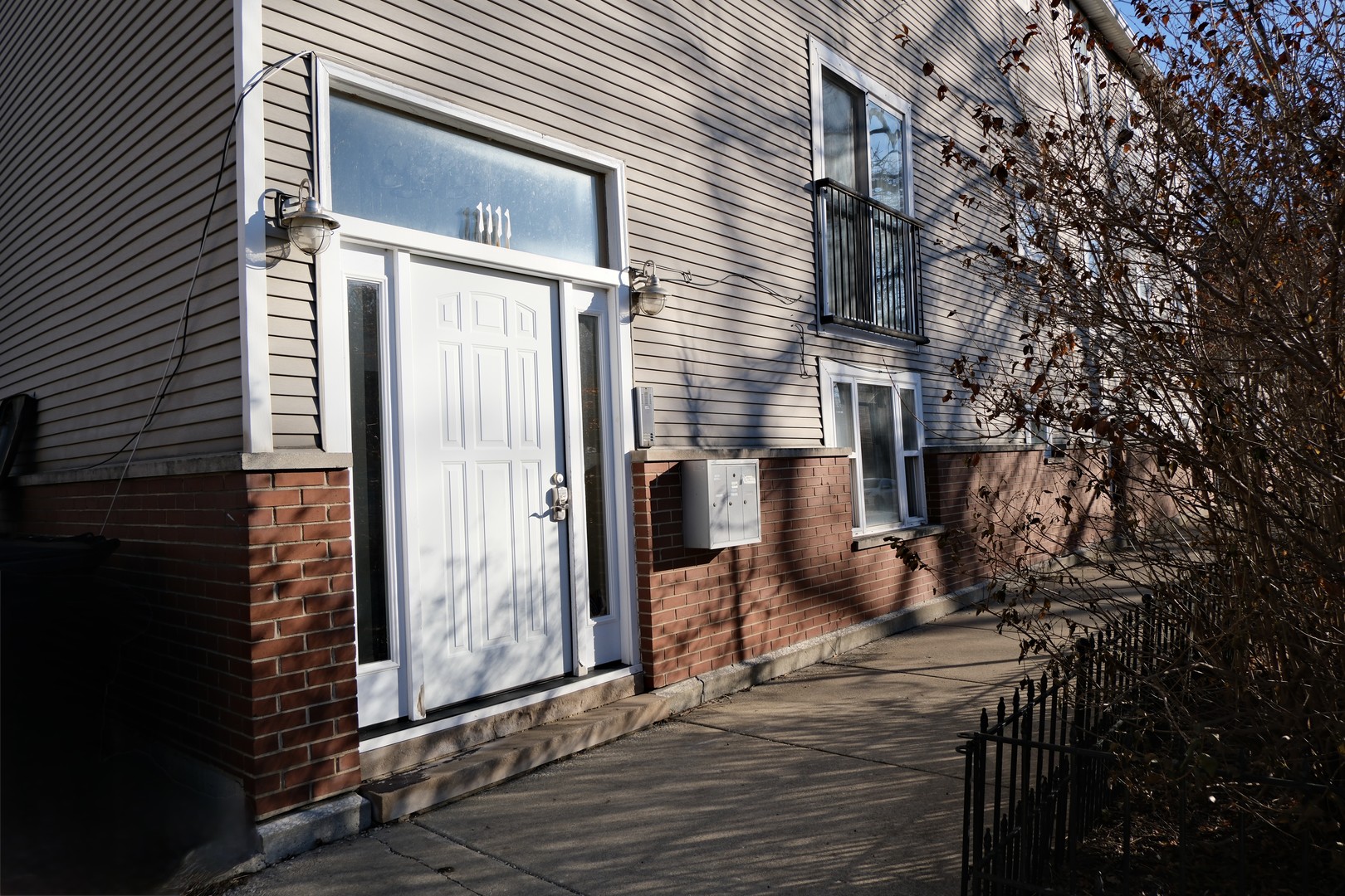 1111 North Honore Street, Unit 1 Chicago, IL 60622 - Photo 1 of 16 a view of a house with backyard and wooden fence