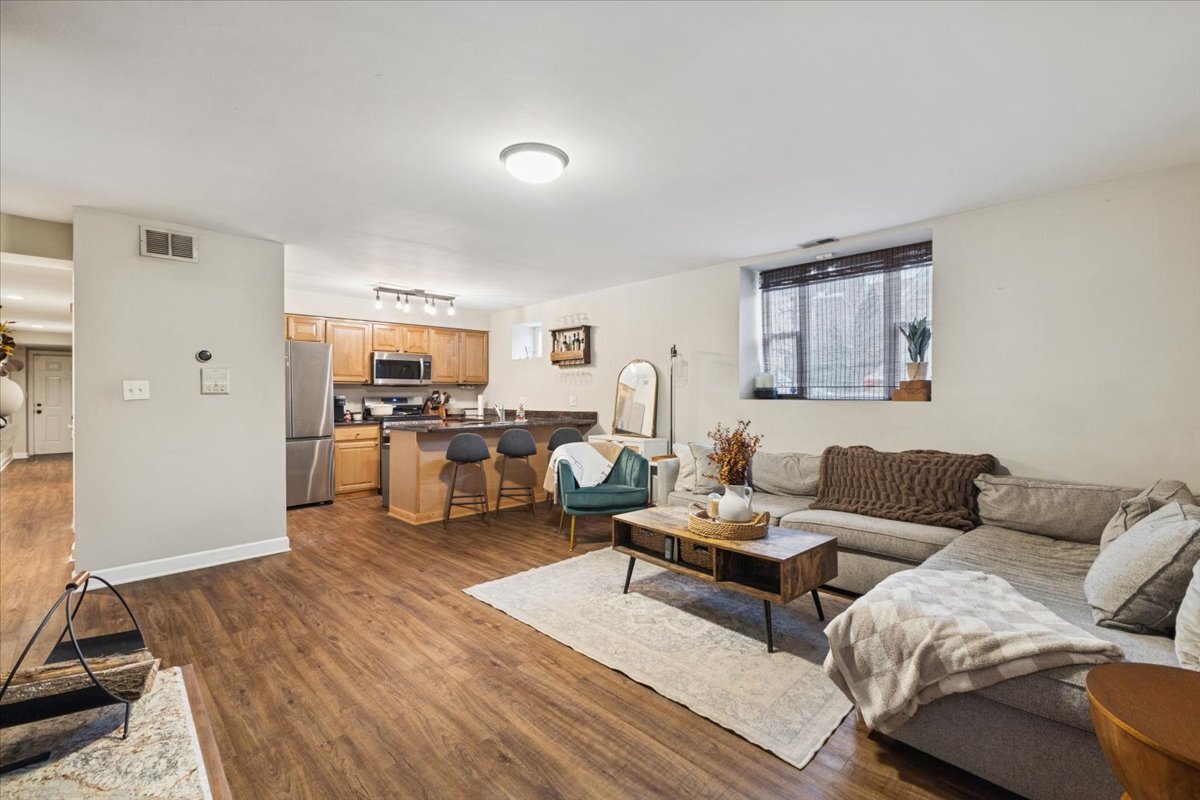 1111 North Honore Street, Unit 1 Chicago, IL 60622 - Photo 2 of 16 a living room with furniture and view of kitchen