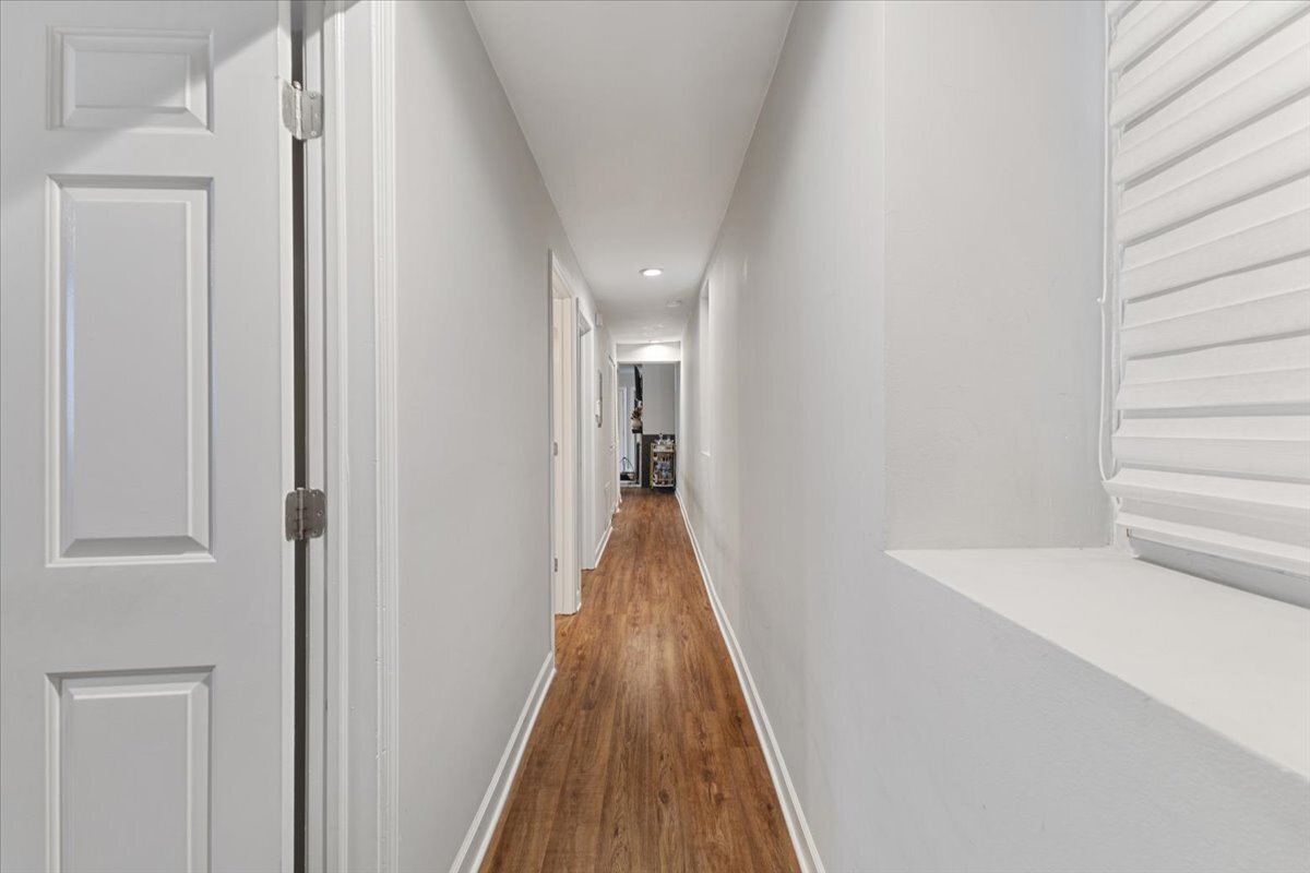 1111 North Honore Street, Unit 1 Chicago, IL 60622 - Photo 6 of 16 a view of a hallway with wooden floor and staircase