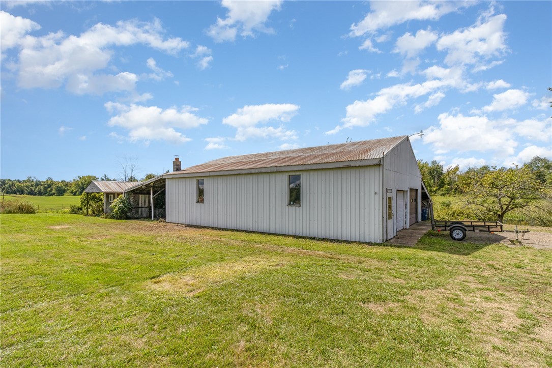 4480 Pilgrimport Road Sodus, NY 14489 - Photo 15 of 27 Huge two bay garage with car lift, plus covered st