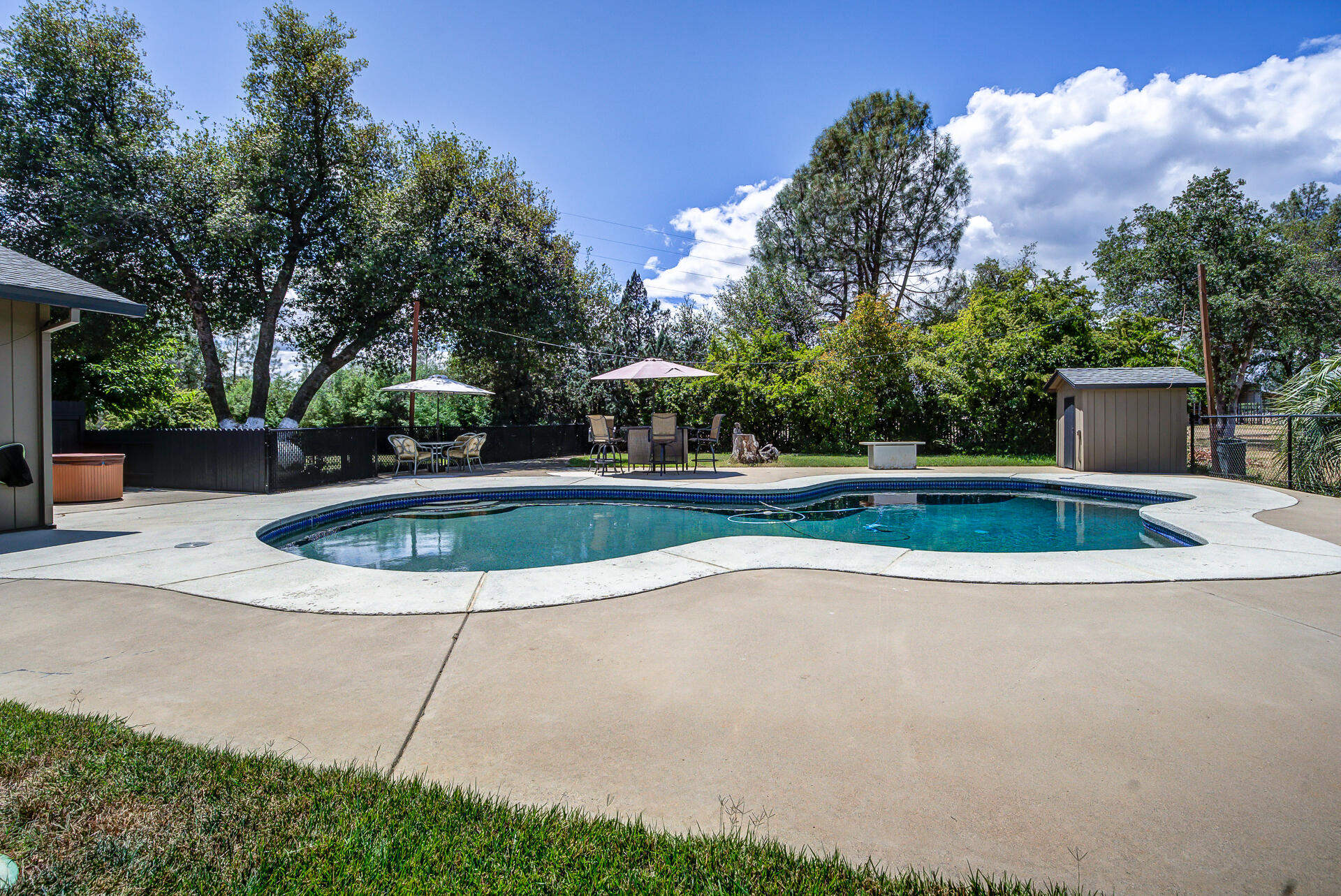 17536 Oly Way Anderson, CA 96007 - Photo 35 of 51 a view of outdoor space yard swimming pool and sitting area