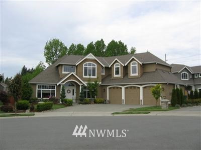 20622 38th Drive Southeast Bothell, WA 98021 - Photo 1 of 1 a front view of a house with a yard and garage