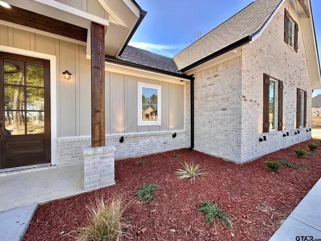 a view of front door of house with yard