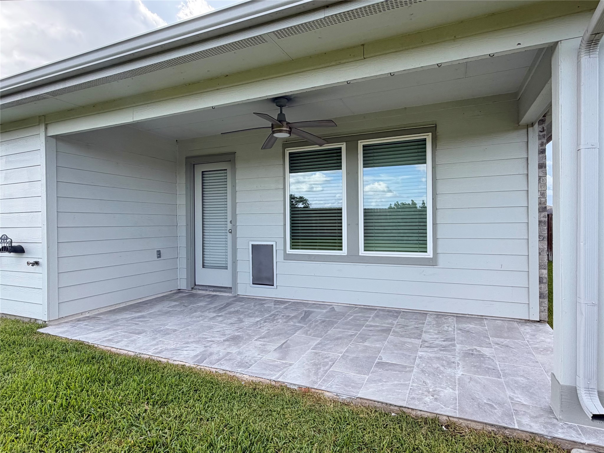 41 Desert Spring Lane Manvel, TX 77578 - Photo 17 of 18 View of the back porch with tile floors ready for relaxing in the evenings.
