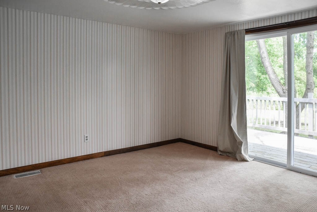 3703 Johnson Road Norton, OH 44203 - Photo 13 of 24 Bedroom 1 with a large closet and private access to the back deck.