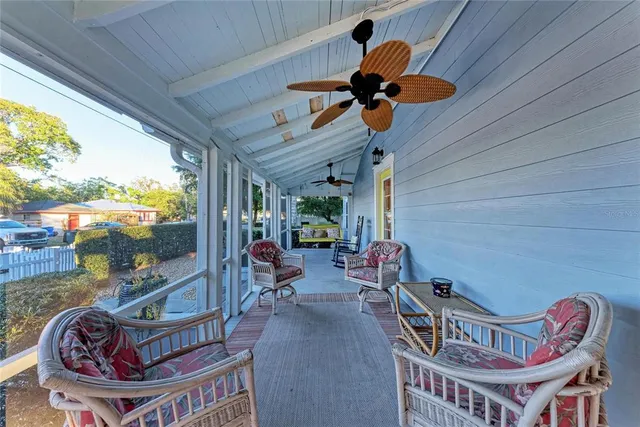 a kitchen with stainless steel appliances kitchen island a table and chairs in it