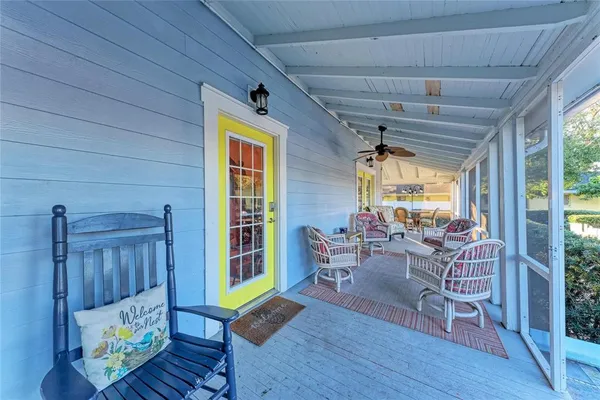 a kitchen with stainless steel appliances kitchen island a table and chairs