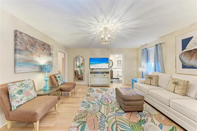 a bedroom with a bed couch and a window