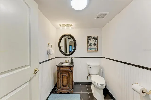 a bedroom with a large bed and a couch