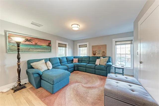 an aerial view of a house with a yard and outdoor seating
