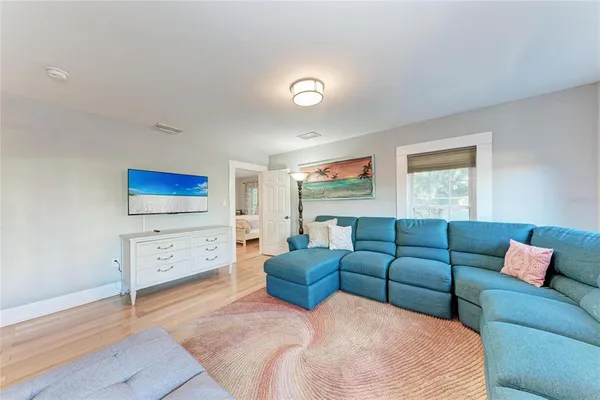 an aerial view of a house with a yard and lake view