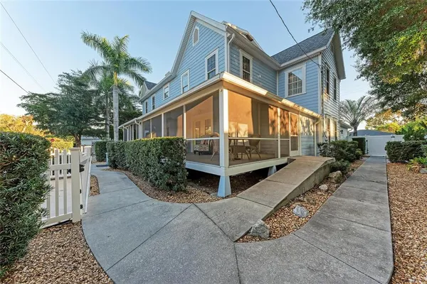 a living room filled with furniture hardwood floor and a table