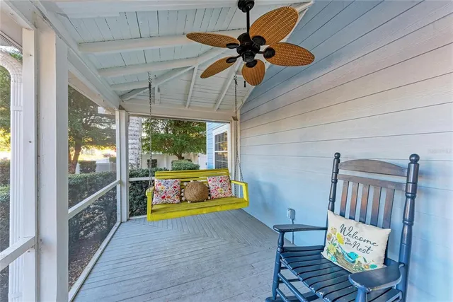 a living room with furniture fireplace and a large window