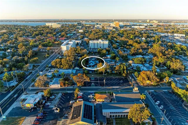 a living room filled with furniture hardwood floor and a table