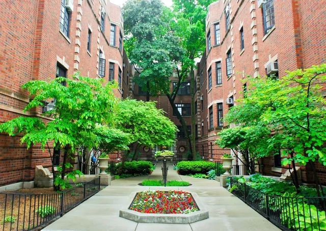 a front view of a building with garden