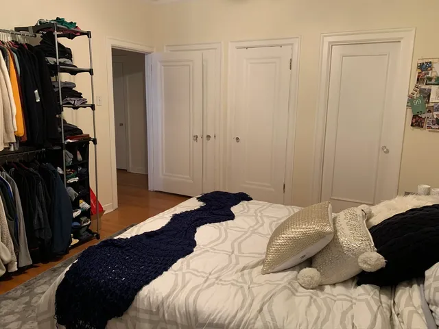 a bedroom with a bed and a closet