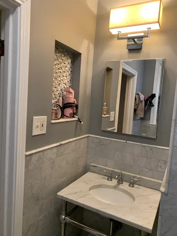 a bathroom with a sink and a mirror