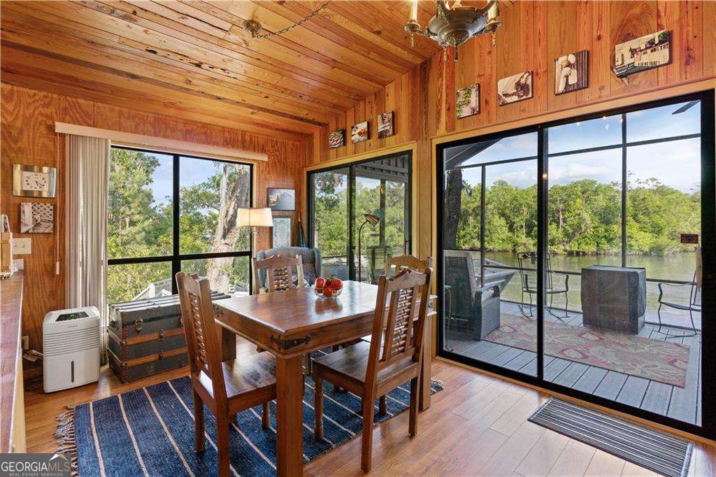 4631 Bailey Mill Road White Oak, GA 31568 - Photo 19 of 38 a view of a dining room with furniture window and outside view