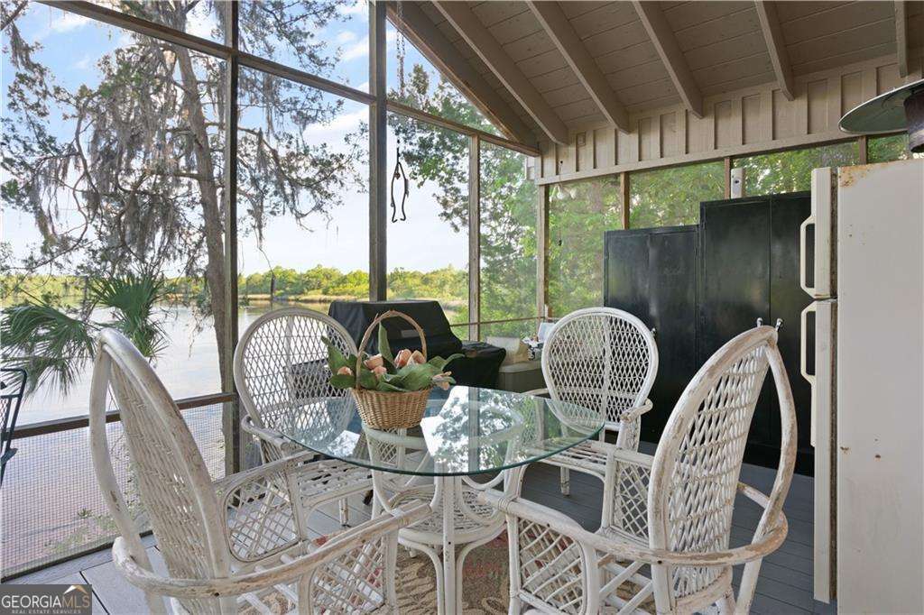 4631 Bailey Mill Road White Oak, GA 31568 - Photo 25 of 38 a view of balcony and dining area with furniture