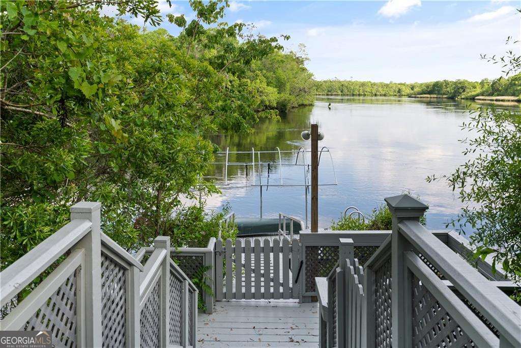 4631 Bailey Mill Road White Oak, GA 31568 - Photo 29 of 38 a view of a balcony with lake view and wooden floor