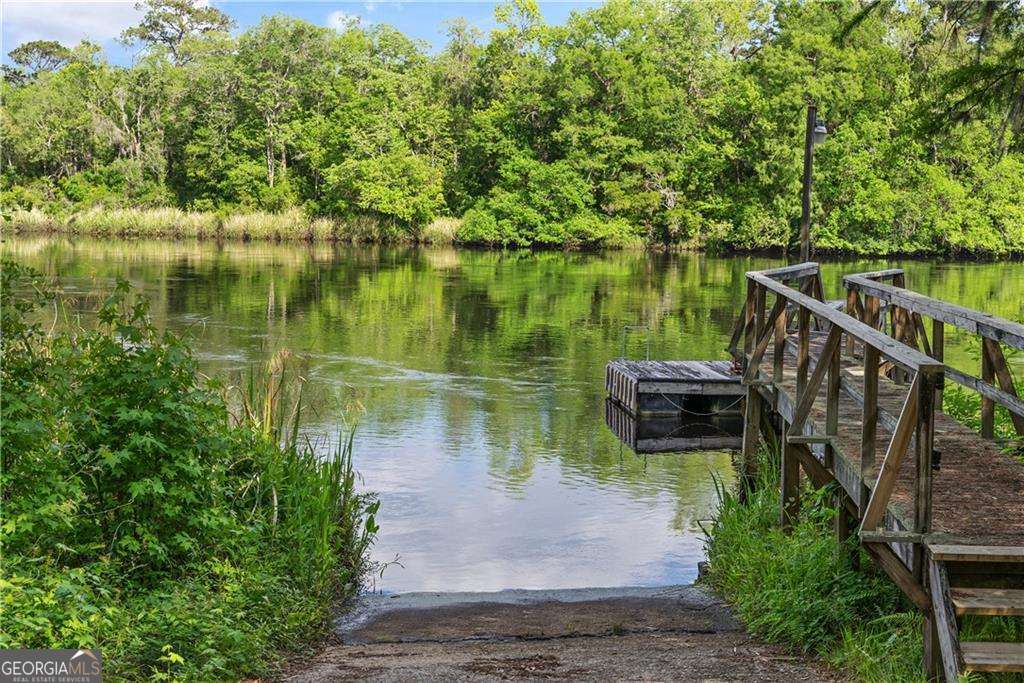 4631 Bailey Mill Road White Oak, GA 31568 - Photo 36 of 38 a view of a wooden deck with lake view