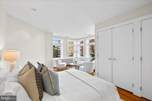 a bed room with a bed and a window