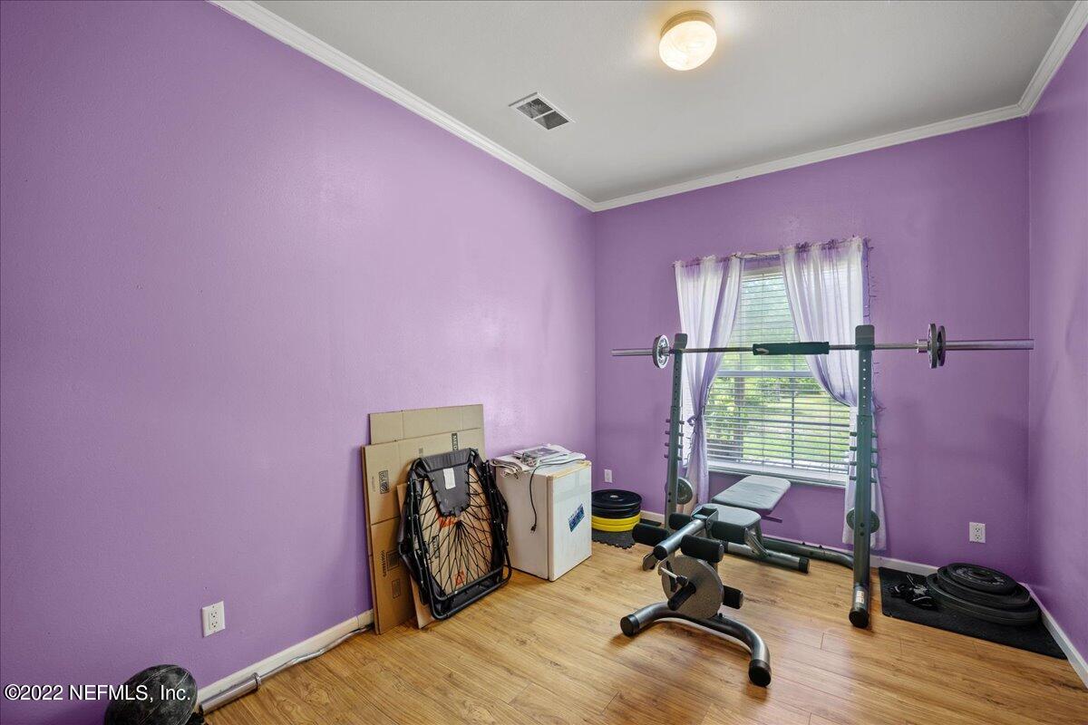 101 Sand Lake Road Interlachen, FL 32148 - Photo 14 of 40 a view of a workspace with furniture and a window