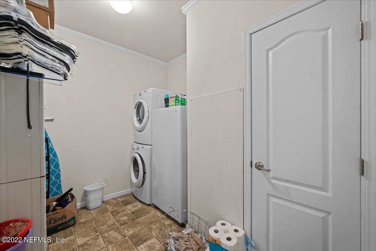 101 Sand Lake Road Interlachen, FL 32148 - Photo 18 of 40 a bathroom with a granite countertop toilet and a shower