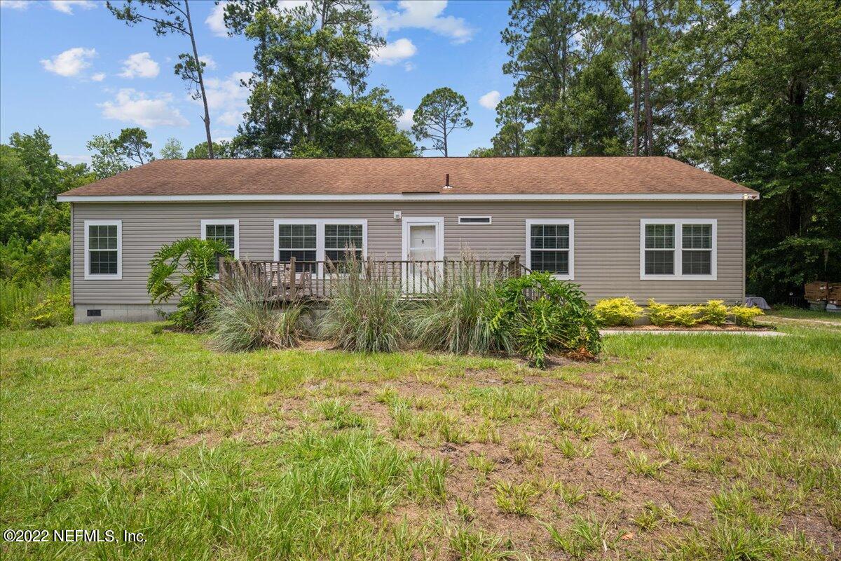 101 Sand Lake Road Interlachen, FL 32148 - Photo 21 of 40 a view of a house with a yard