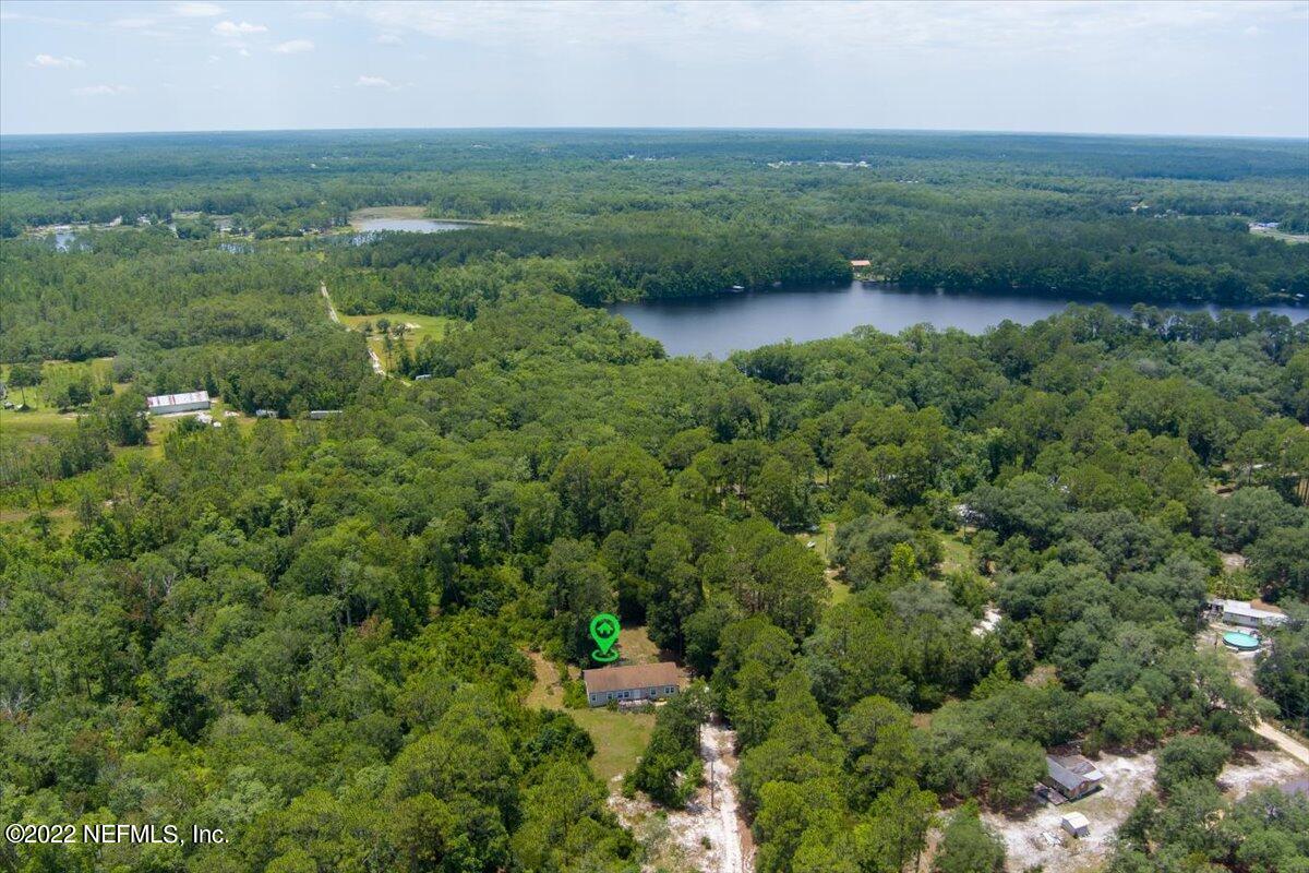 101 Sand Lake Road Interlachen, FL 32148 - Photo 28 of 40 an aerial view of residential houses with outdoor space and trees