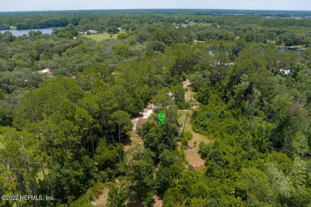 101 Sand Lake Road Interlachen, FL 32148 - Photo 29 of 40 an aerial view of residential houses with outdoor space and trees