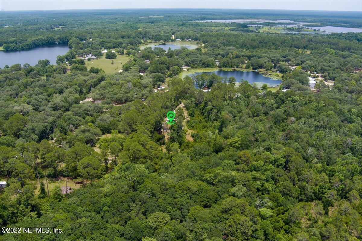 101 Sand Lake Road Interlachen, FL 32148 - Photo 30 of 40 a view of a forest with a houses