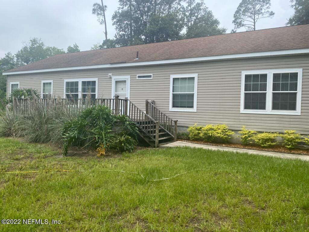 101 Sand Lake Road Interlachen, FL 32148 - Photo 33 of 40 a view of house with backyard and garden