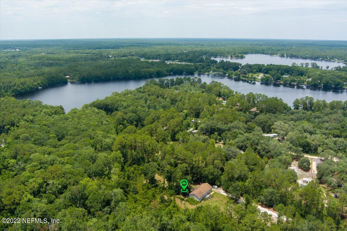 101 Sand Lake Road Interlachen, FL 32148 - Photo 34 of 40 an aerial view of residential houses with outdoor space and trees