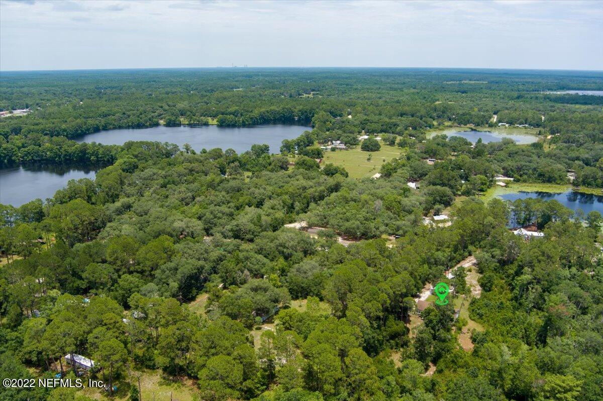 101 Sand Lake Road Interlachen, FL 32148 - Photo 36 of 40 an aerial view of residential houses with outdoor space and trees