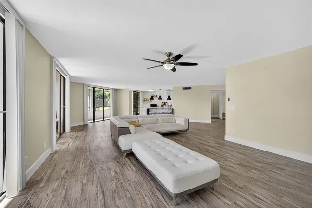 a large bed sitting in a bedroom next to a window